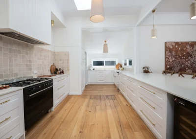 black, white, and light wood kitchen in Maleny Country House