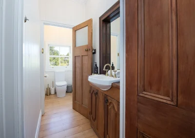 toilet and wooden cabinets North Maleny Country Cottage